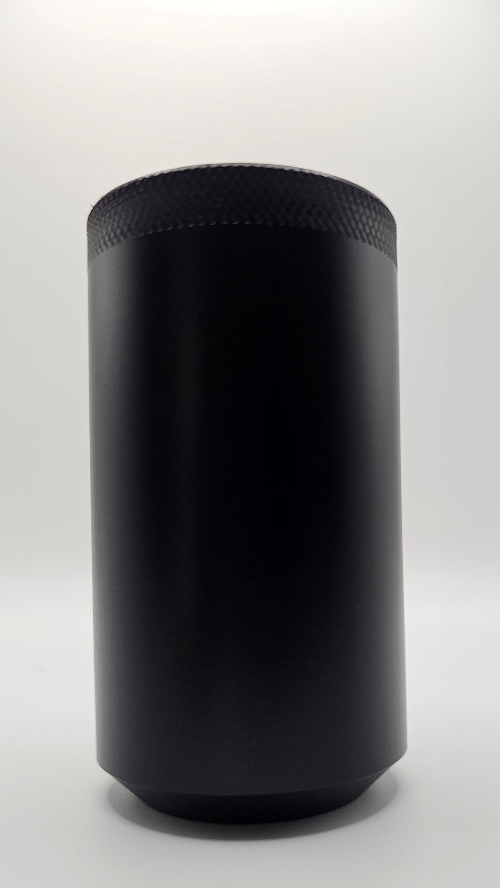 Black cylindrical container on a white background, shift knob, black, white, delrin, weighted, clean, tapered
