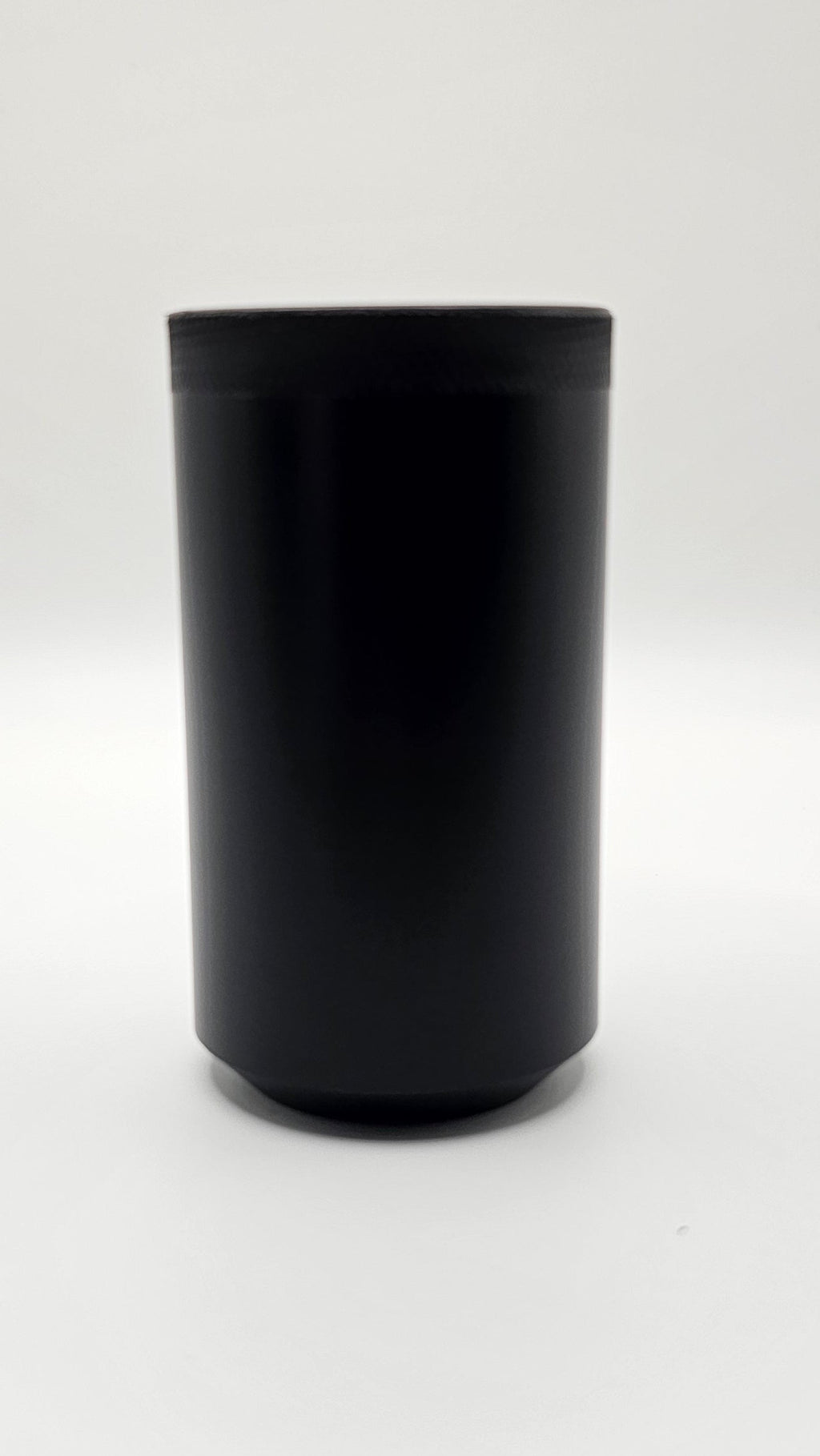 Black cylindrical container on a white background, shift knob, black, white, delrin, weighted, clean, tapered