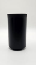 Black cylindrical container on a white background, shift knob, black, white, delrin, weighted, clean, tapered