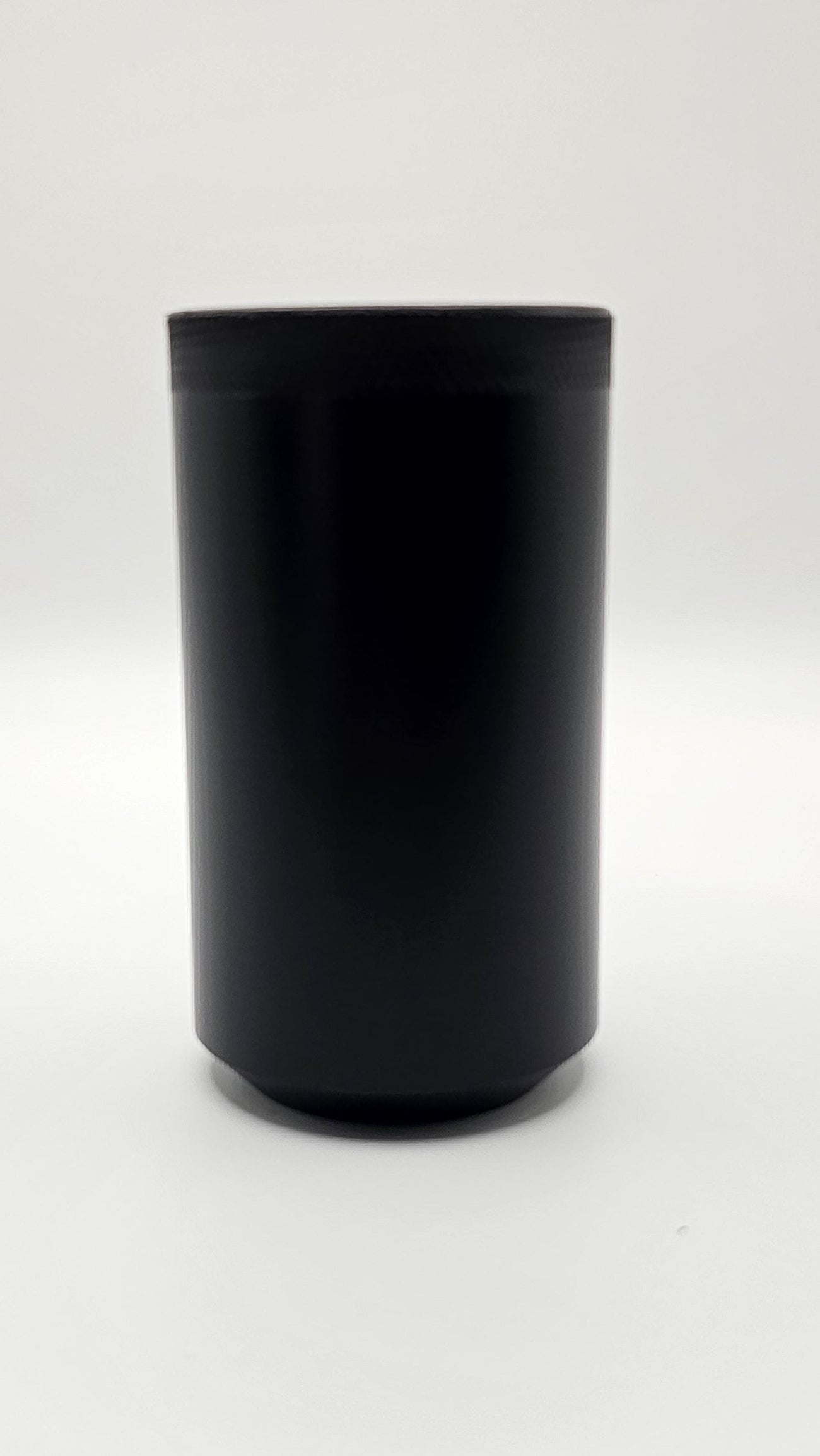 Black cylindrical container on a white background, shift knob, black, white, delrin, weighted, clean, tapered