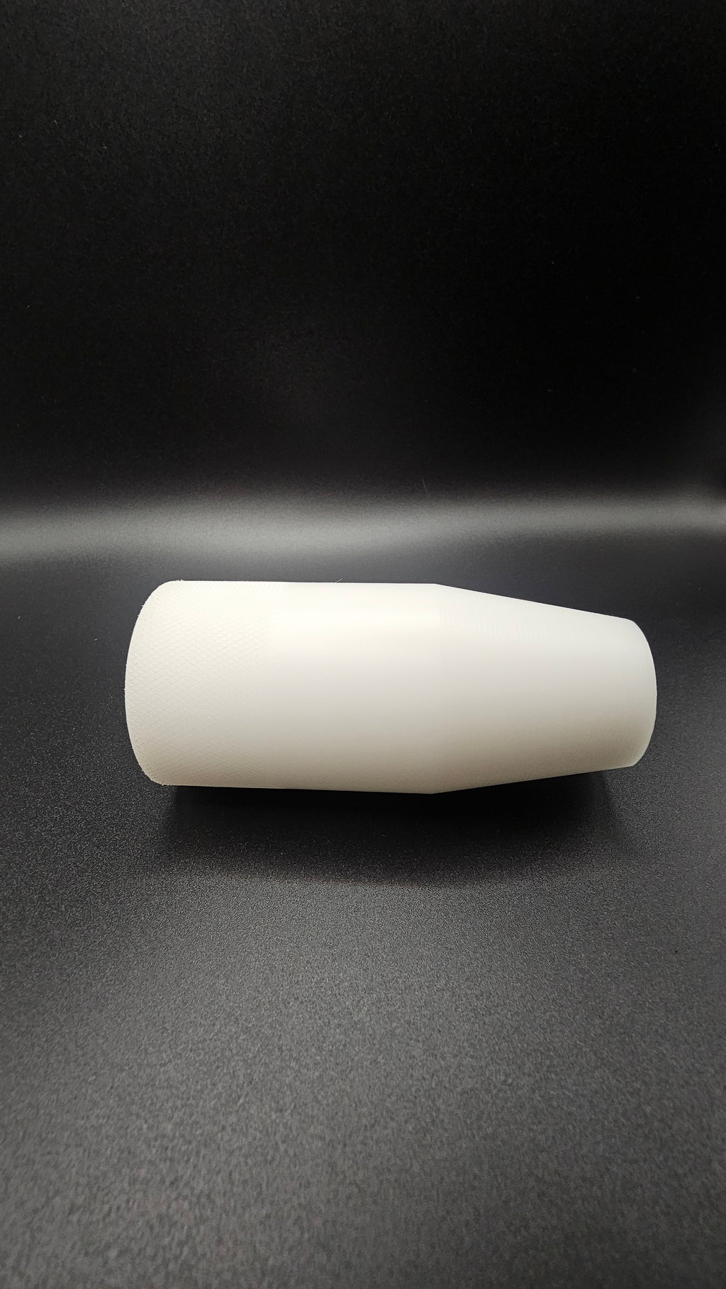 Black cylinder on a white background, shift knob, black, white, delrin, weighted, clean, tapered