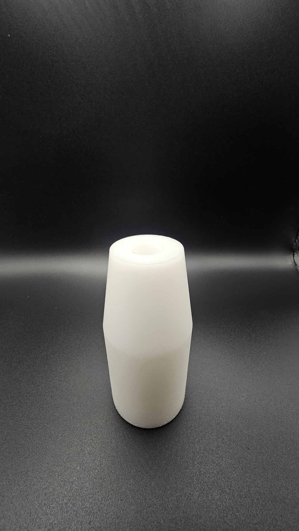 Black cylinder on a white background, shift knob, black, white, delrin, weighted, clean, tapered